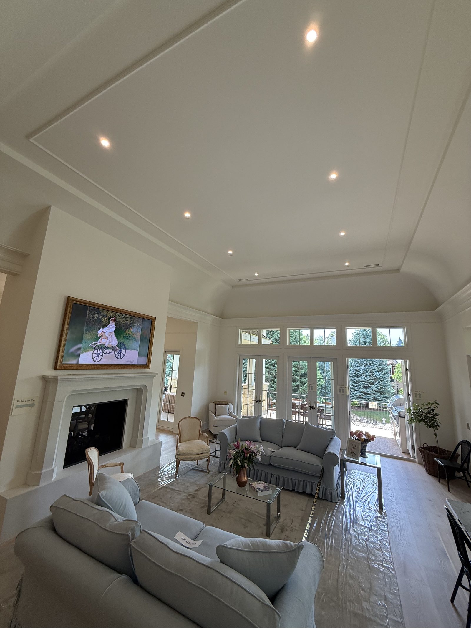 Finished great room with vaulted ceiling, freshly painted in warm white